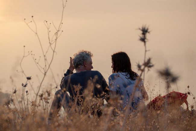 Пара в поле на закате